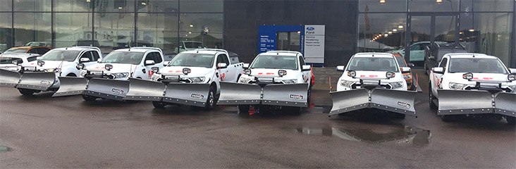 Ford rangers equipped with Hilltip snowplows and salt spreaders